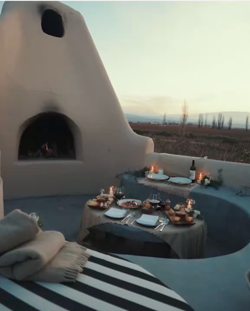 Romantic outdoor dining with fireplace at Awasi Mendoza